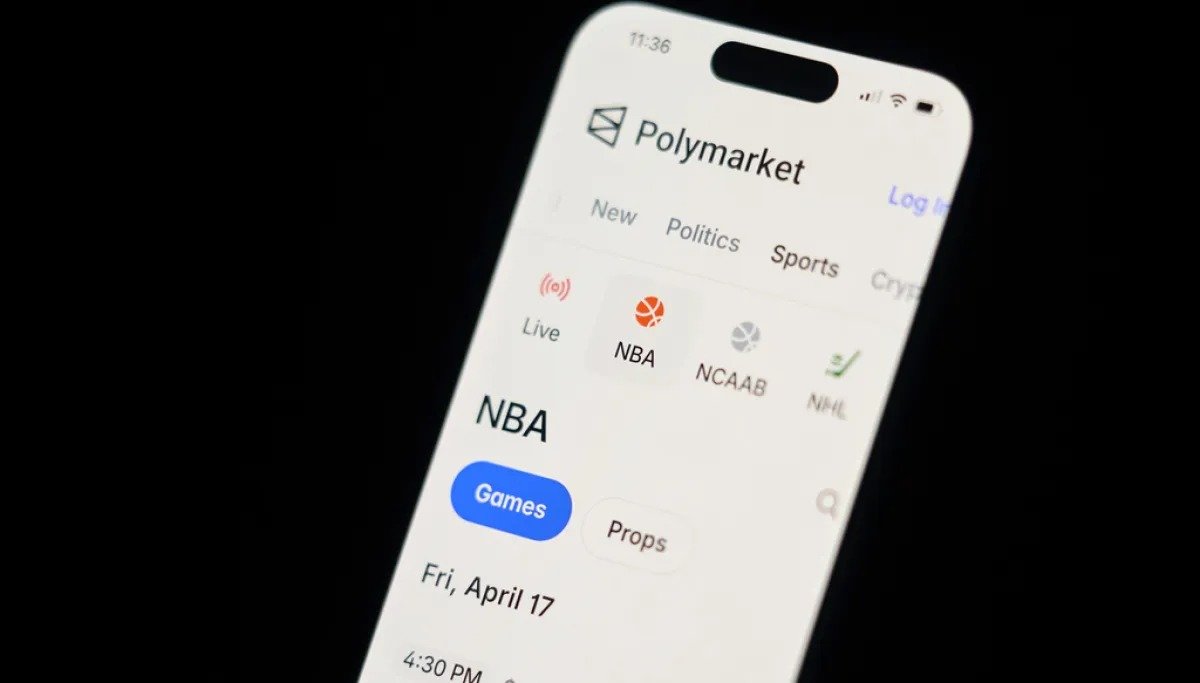 Polymarket app shown on a phone